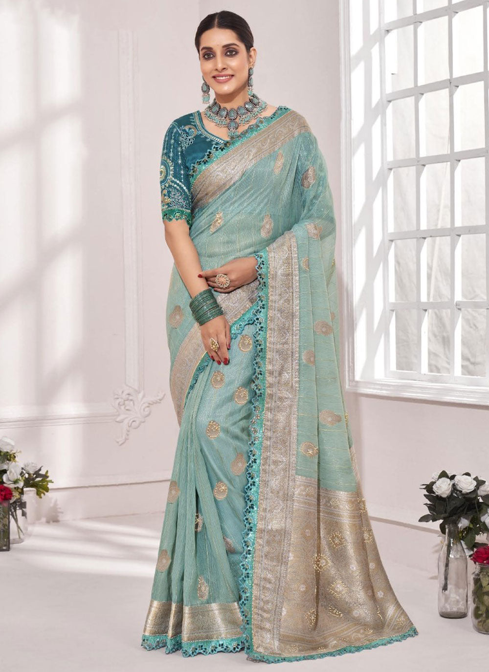 Teal Designer Sari With Embroidered And Weaving Work