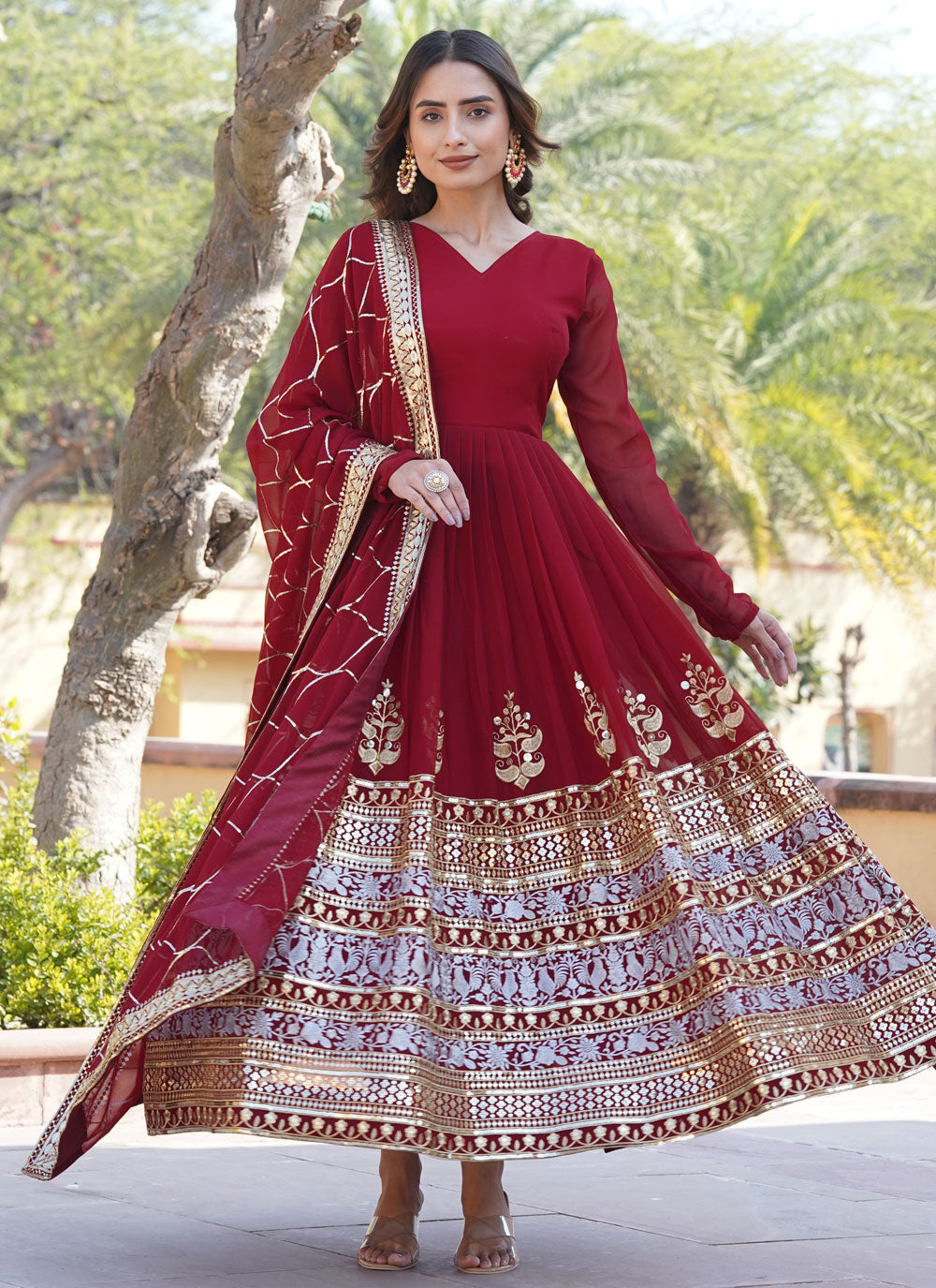 Maroon Faux Georgette Gown With Embroidered And Sequins Work