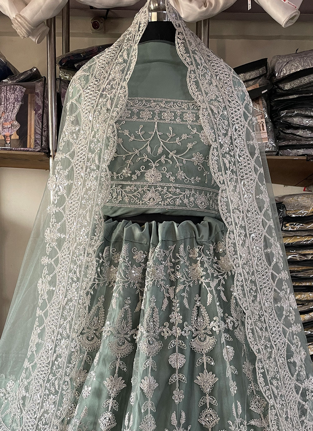 Turquoise Net Embroidered And Sequins Work Lehenga Choli
