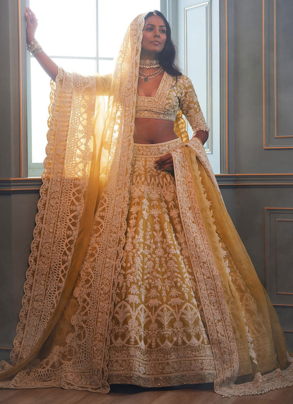 Embroidered And Sequins Work Net Lehenga Choli In Yellow